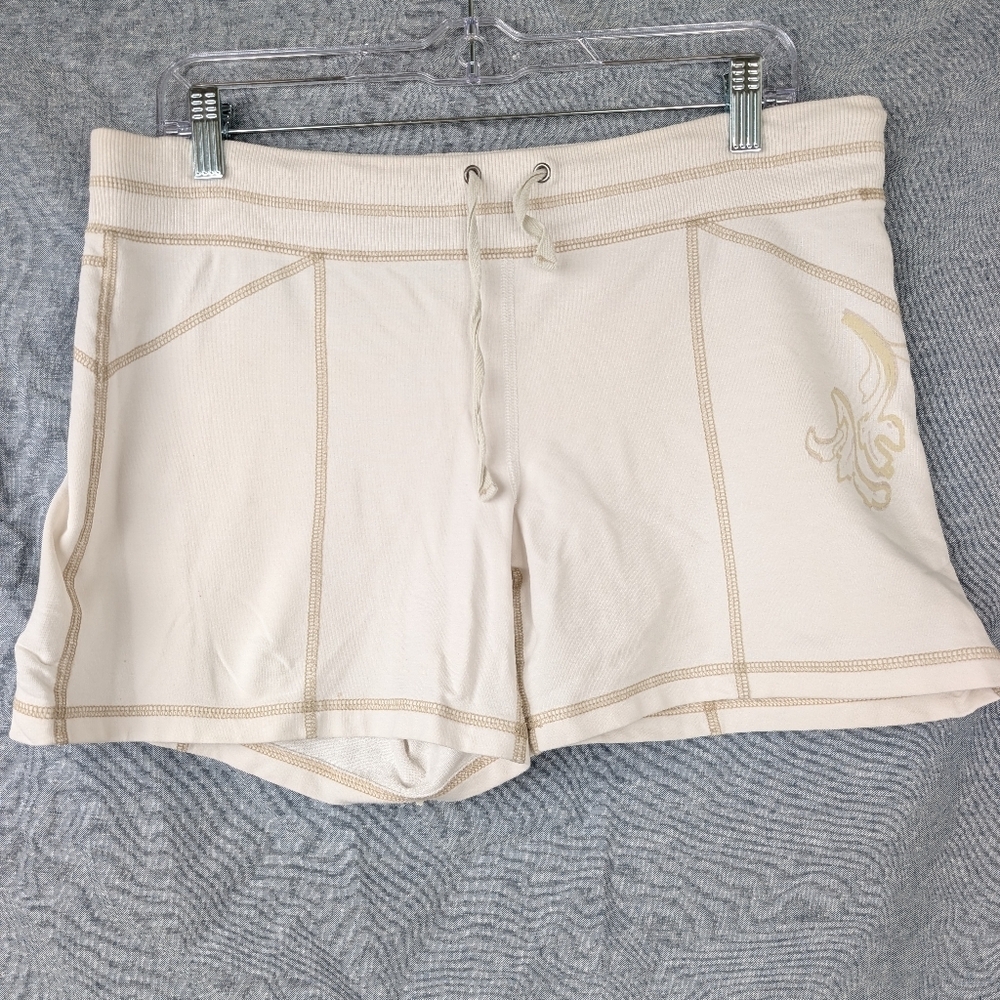 Athleta cream French terry shorts w/contrast stitching floral detail